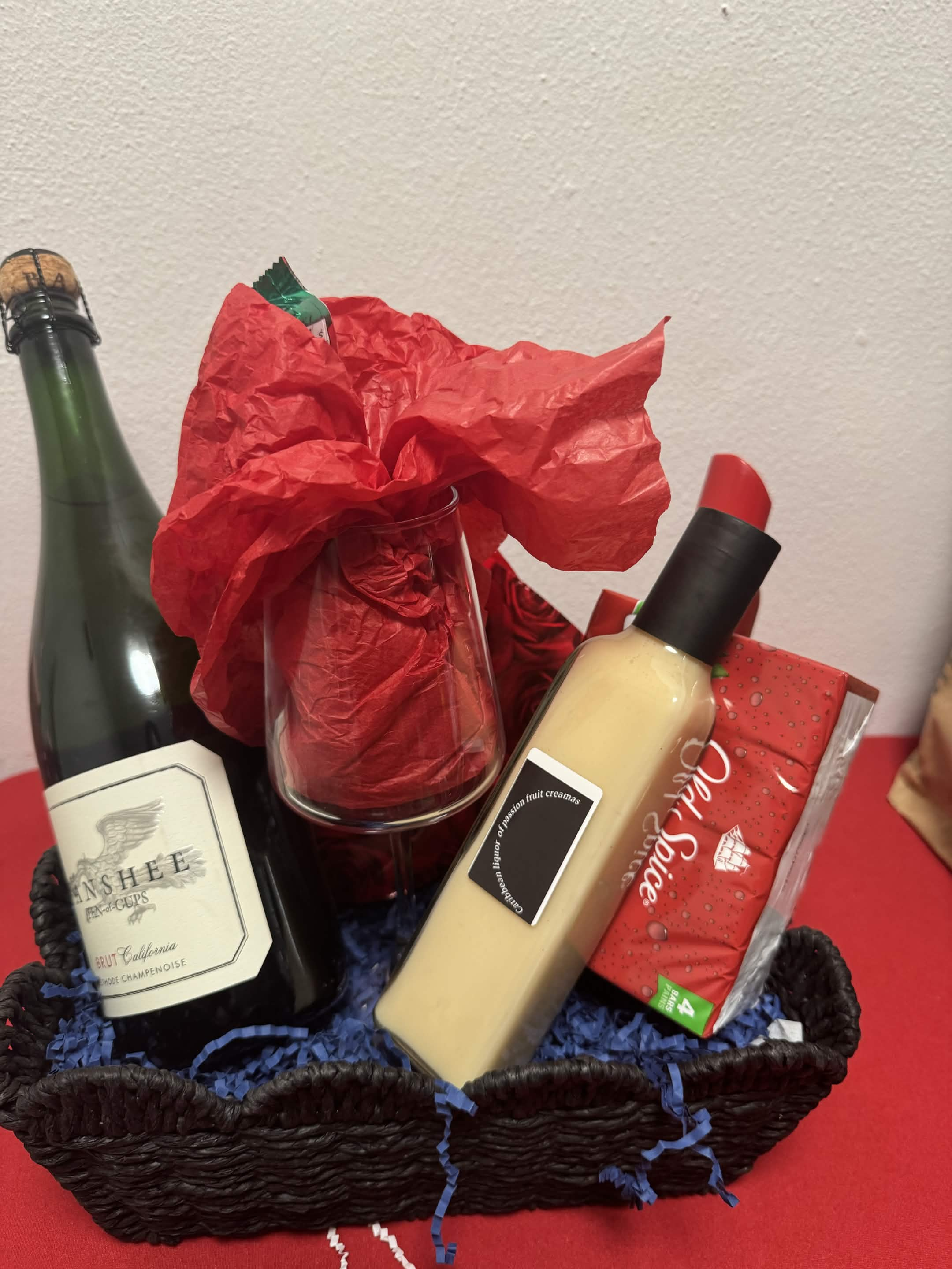 Luxury Grand gift basket with wine, candles, a plush throw, and silk ribbon