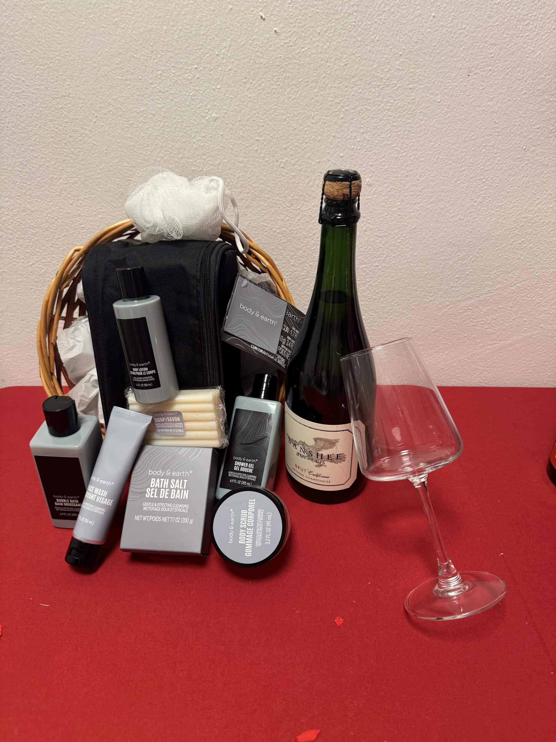Luxury Indulgence gift basket overflowing with premium items and a burgundy ribbon