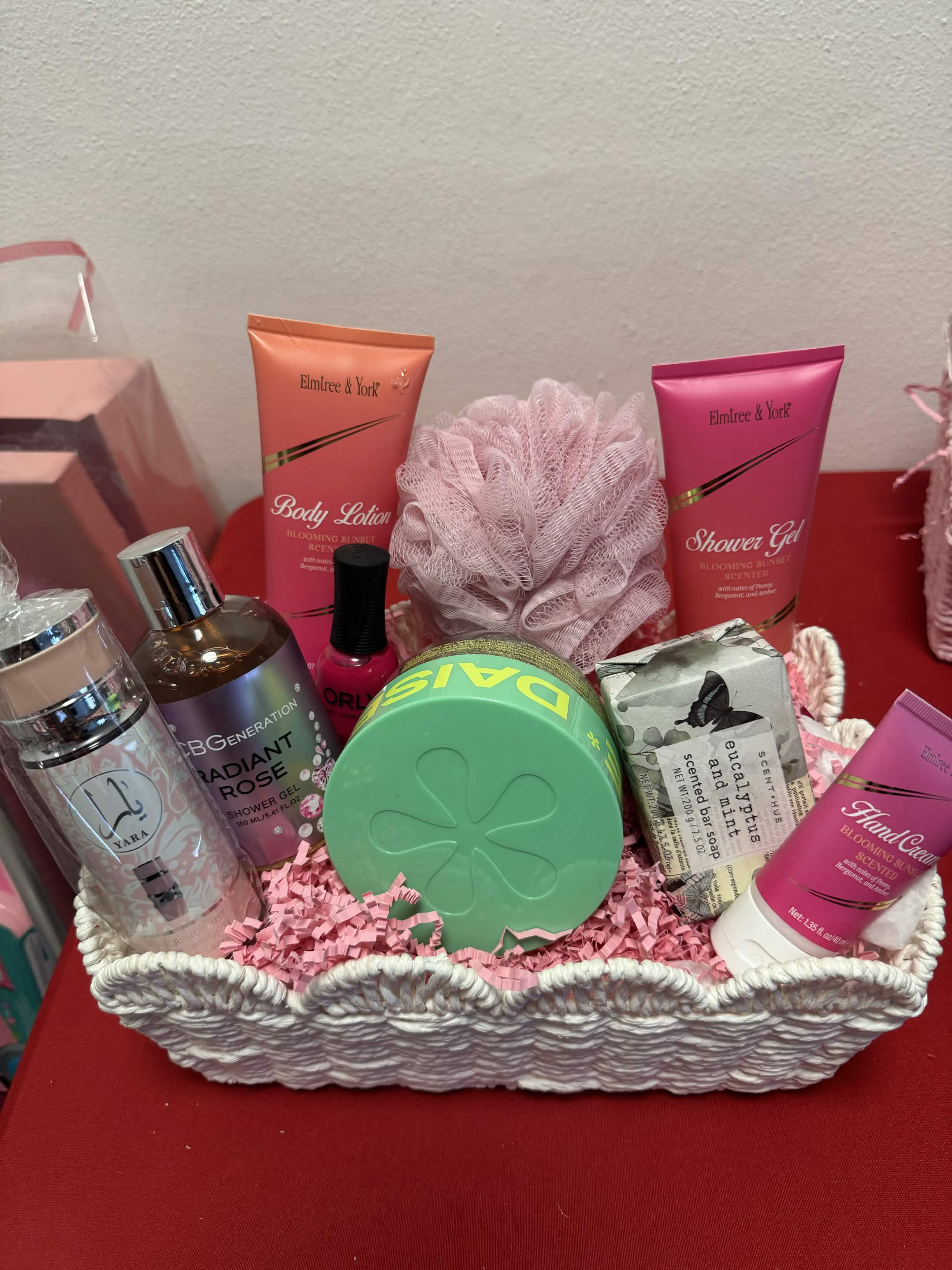 Premium Elite gift basket with champagne, luxury skincare, and fresh roses